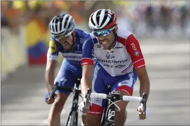  ?? THIBAULT CAMUS — THE ASSOCIATED PRESS ?? France’s Thibaut Pinot, right, and Julian Alaphilipp­e crosse the finish line July 13 during the eighth stage of the Tour de France between Macon and Saint Etienne, France.