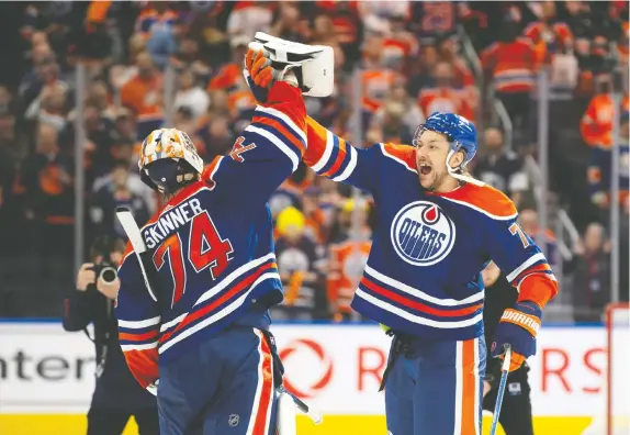  ?? CODIE MCLACHLAN/GETTY IMAGES ?? Oilers goaltender Stuart Skinner and defenceman Vincent Desharnais celebrate Wednesday's series-clinching victory over the Kings at Rogers Place. The Oilers look and sound like a team that can contend for the Stanley Cup, Robert Tychkowski says.