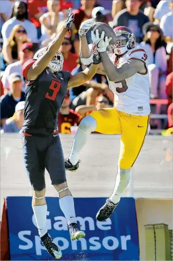  ?? Chris Coduto Getty Images ?? THIS TURNED INTO the third touchdown reception of the day for JuJu Smith-Schuster, who adjusted to the throw from Sam Darnold and took the ball away from Arizona cornerback Dane Cruikshank.