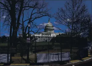  ?? CAROLYN KASTER — THE ASSOCIATED PRESS ?? The U.S. Capitol is seen behind security fencing after a car crashed into a barrier Friday.