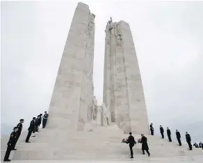  ?? — THE CANADIAN PRESS ?? Prime Minister Justin Trudeau lays a wreath on the Canadian National Vimy Memorial on Saturday at Vimy Ridge, the day before the 100th anniversar­y of the Armistice.
