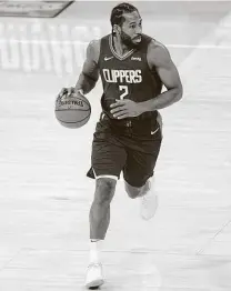  ?? Kyusung Gong / Associated Press ?? Former Spur Kawhi Leonard and the Clippers get the first shot of trying to knock off the defending champions tonight.