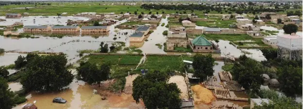  ?? Photo: Sani Maikatanga ?? A recent aerial view of some parts of Hadejia town in Jigawa State with farms flooded