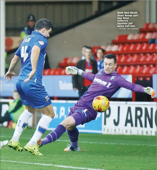  ?? PICTURE: Will Kilpatrick ?? MAIN MAN MILAN: Stuart Nelson can’t stop Milan Lalkovic’s equaliser just before half-time