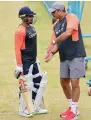 ?? PTI ?? India’s coach Ravi Shastri gives tips to Karun Nair. —