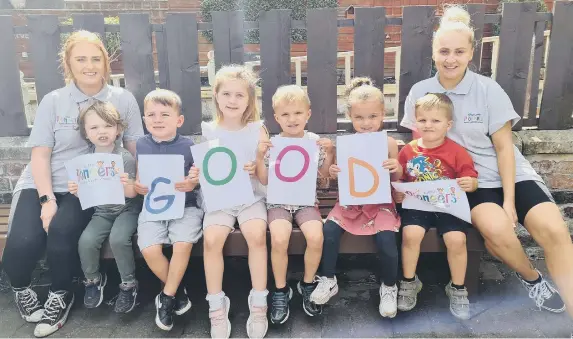  ?? ?? Early Years Assistant Shauna McKinney, left, and Sophie Watchman, Room Manager, celebratin­g their good Ofsted judgement with children at the nursery.