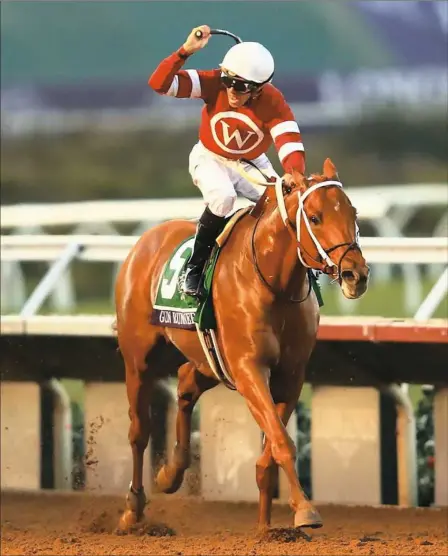  ?? Sean M. Haffey/Getty Images ?? Gun Runner, with Florent Geroux aboard, romps home to win the $6 million Breeders’ Cup Classic Saturday at Del Mar Race Track in Del Mar, Calif,