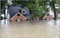  ??  ?? A home in Spring, Texas, flooded by Hurricane Harvey