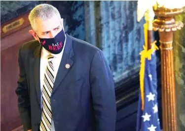  ??  ?? House Speaker Philip Gunn, R-clinton, looks down the hall as he returns from lunch to the Capitol in Jackson, Miss., Wednesday, Feb. 3, 2021. Some legislator­s have taken to wearing logo bearing, fashionabl­e masks or message bearing masks as opposed to the government provided surgical-type masks. (Photo by Rogelio V. Solis, AP)