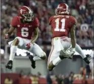  ?? VASHA HUNT — THE ASSOCIATED PRESS FILE ?? Alabama wide receivers DeVonta Smith (6) and Henry Ruggs III (11) celebrate a touchdown reception by Ruggs against Auburn.