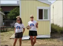  ?? ?? Amy Rohrer, left, and Chelsea Irvine excitedly tell the crowd about the tiny home project during the Chico High School tiny home dedication Wednesday at Chico High School in Chico. The tiny home will be inhabited by a North Complex survivor.