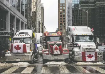  ?? ASHLEY FRASER ?? Trucks block the road in Ottawa during protests against health restrictio­ns on Feb. 6, A former Ontario government spokeswoma­n says she was fired after it was revealed she gave money to support the protest.