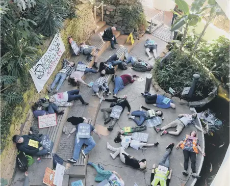  ??  ?? Climate activists play dead to highlight the impact of climate change at Sunderland Museum and Winter Gardens.