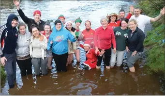  ??  ?? Participan­ts take a dip at the Boeing swim on the River Blackwater on New Year’s Day.