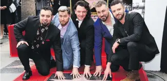  ?? JORDAN STRAUSS/THE ASSOCIATED PRESS ?? Chris Kirkpatric­k, Lance Bass, JC Chasez, Joey Fatone and Justin Timberlake enjoyed success as the early 2000s heartthrob boy band ’N Sync, which kick-started Timberlake’s career.