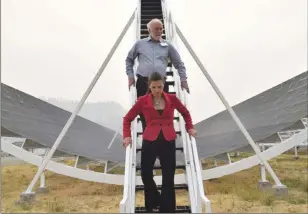  ?? The Okanagan Weekend ?? UBC physicist Mark Halpern and Kirsty Duncan, formerly the federal science minister, descend from part of the CHIME telescope at its unveiling in 2017.