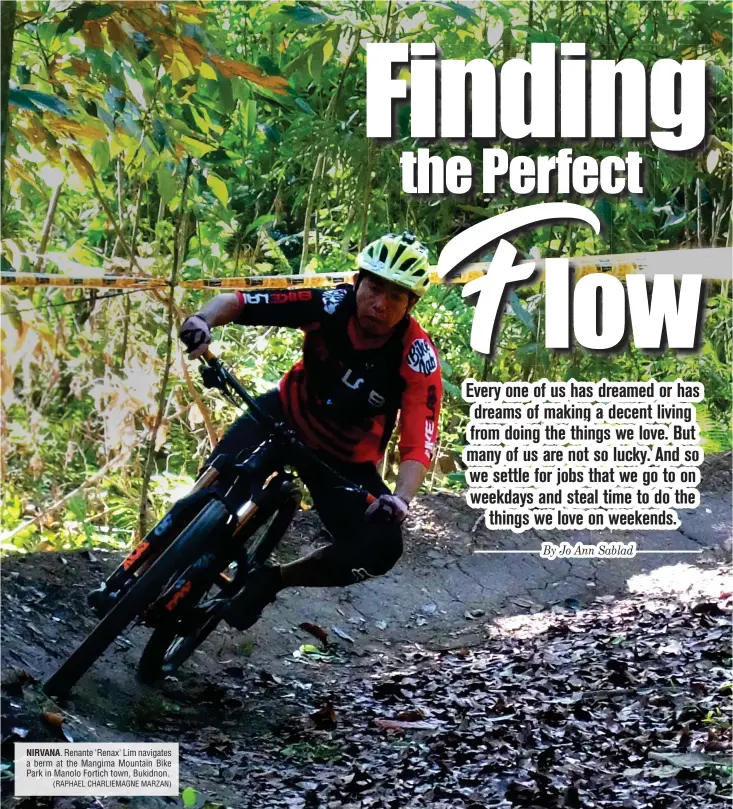  ?? (RAPHAEL CHARLIEMAG­NE MARZAN) ?? NIRVANA. Renante 'Renax' Lim navigates a berm at the Mangima Mountain Bike Park in Manolo Fortich town, Bukidnon.