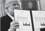  ?? Chip Somodevill­a / Getty Images ?? Taxpayers are now finding out the impact of the tax bill President Donald Trump signed in December 2017.