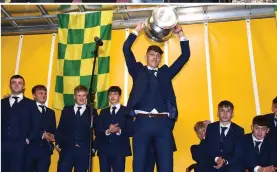  ??  ?? RIGHT:
Kerry Minor Captain David Clifford from Fossa lifts the Tommy Markham Cup