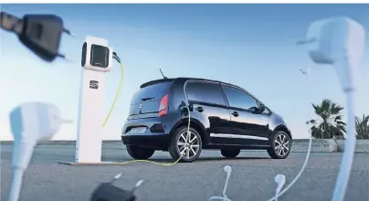  ?? FOTOS: DPA ?? Wo geht die Reise der Kleinwagen hin? Der VW-Konzern setzt auf E-Mobililtät wie etwa auch beim Seat Mii Electric.