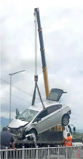  ?? Photo: Arieta Vakasukawa­qa ?? Police co-ordinate the salvaging of the vehicle that Shalveen Goundar died in after a horrific accident at Waimalika Bridge in Sabeto, Nadi, on January 17, 2018.