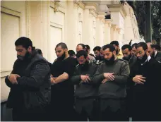  ?? Mohammed Kamal ?? Egyptian police at a 2013 vigil calling on former ruler Mohamed Morsi to allow officers to grow longer beards