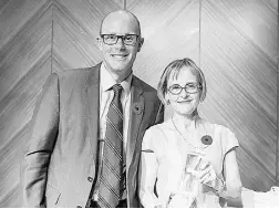  ??  ?? Anne Giardini, right, of Simon Fraser University,
accepts the 2015 Lifetime Achievemen­t Award.