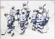  ?? PHOTOS BY JASON FRANSON — THE CANADIAN PRESS VIA AP ?? Tampa Bay Lightning players celebrate a win over the Dallas Stars in Game 3of the NHL hockey Stanley Cup Final, Wednesday, in Edmonton, Alberta.