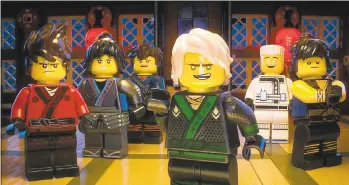  ?? WARNER BROS. ?? Lloyd (voiced by Dave Franco), front, as the Green Ninja leads his crew of teenage ninjas in “The LEGO Ninjago Movie.”