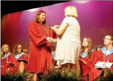  ?? Janelle Jessen/Siloam Sunday ?? School counselor Lesa Eaves presented Dianna Spears with a scholarshi­p during the 41st annual Scholarshi­p Awards Program on Thursday evening. More than $555,000 in local scholarshi­ps and $5.7 million in college, military and state financial aid was...