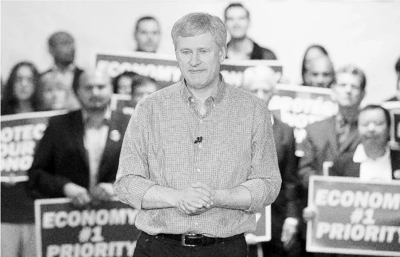  ?? Nick Procaylo
/ Vancouv er Province ?? Conservati­ve Leader Stephen Harper unveils his “low-tax, balanced- budget plan” on the campaign trail in Richmond, B.C., on Friday. He says voters will “make a choice for proven leadership.”