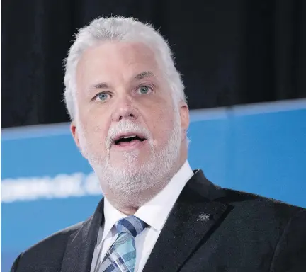  ?? PAUL CHIASSON/THE CANADIAN PRESS FILES ?? There is speculatio­n that Premier Philippe Couillard may trigger Quebec’s general election campaign several days earlier than planned. While the actual Oct. 1 election date will not change, the campaign could end up being as long 39 days.