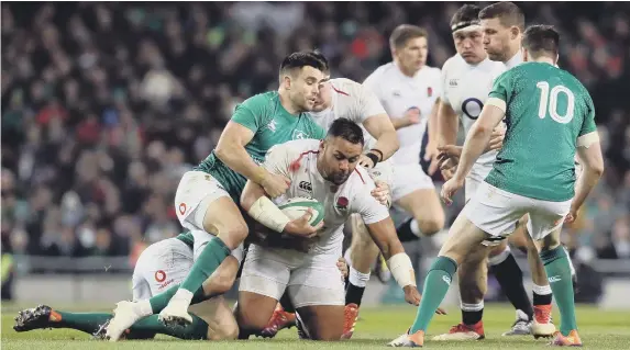  ??  ?? England’s Billy Vunipola gets tackled by Ireland’s Conor Murray during the Guinness Six Nations match at the Aviva Stadium, Dublin.