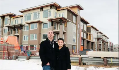  ?? Gavin Young/calgary Herald ?? Michael Gauthier and Betty Ly have purchased a unit in the Next condo developmen­t in Bridgeland by Bucci Developmen­ts Ltd.
