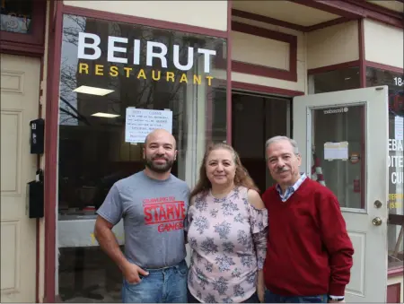  ?? LAUREN HALLIGAN - MEDIANEWS GROUP ?? Left to right: George, Hala and Elias Hajnasr stand in front of Beirut Restaurant in downtown Troy.