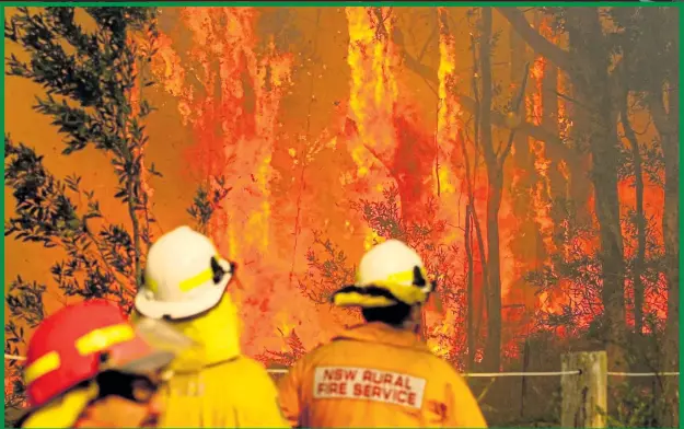  ??  ?? BATTLING: Firefighte­rs are struggling to contain hundreds of bushfires as fresh ones spring up in the heatwave gripping the state of Queensland