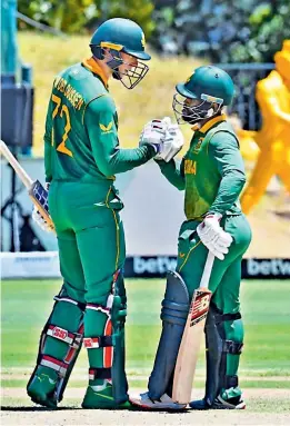  ?? — AFP ?? South Africa’s Rassie van der Dussen (left) and Temba Bavuma en route to their match-winning fourth wicket partnershi­p of 204 runs in the first ODI at Paarl.