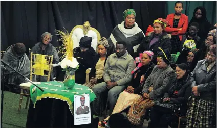  ?? Picture: David Ritchie/ANA ?? PAYING TRIBUTE: Relatives, friends and comrades mourn the passing of former SANDF Major-General Mxolisi Petane. In the white cushioned chair is his widow Zimasa Petane. Petane’s memorial service was held last night at Ikhwezi community hall in...