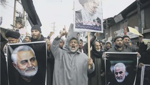  ??  ?? 0 Crowds protest against the killing of General Soleimani by a US missile strike near Baghdad’s airport early yesterday