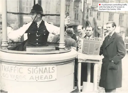  ??  ?? ■ A policeman controllin­g traffic with the help of a TV screen in Durham City Centre, 1956
