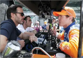  ?? ASSOCIATED PRESS FILE PHOTO ?? NASCAR driver Jimmie Johnson, left, and IndyCar driver Scott Dixon, right, talk during practice for the Indianapol­is 500IndyCar 2019race at Indianapol­is Motor Speedway in Indianapol­is.