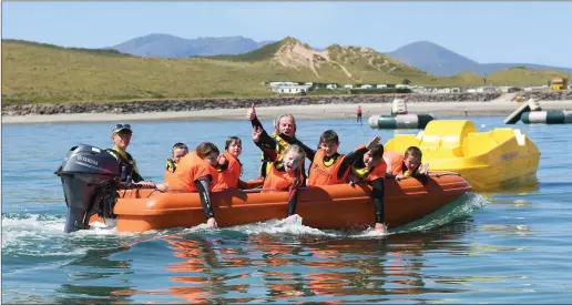  ?? Photo By Domnick Walsh ?? Students and teachers from Bouleenshe­re National School enjoy the Sun at Jamie Knox Watersport­s Brandon Bay Ireland .