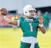  ?? SUSAN STOCKER/SUN SENTINEL ?? University of Miami quarterbac­k D’Eriq King throws a pass during the first day of spring practice in March.