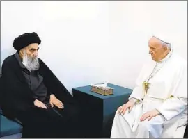  ?? Associated Press ?? POPE FRANCIS talks with Shiite Muslim leader Grand Ayatollah Ali Sistani at Sistani’s home in Najaf, Iraq. It’s the first time a pope has met a grand ayatollah.