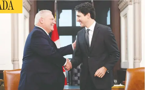  ?? ADRIAN WYLD/THE CANADIAN PRESS ?? Prime Minister Justin Trudeau shakes hands with Ontario Premier Doug Ford at Trudeau’s Parliament Hill office in Ottawa on Friday.