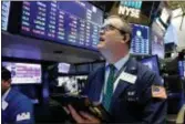  ?? RICHARD DREW — THE ASSOCIATED PRESS ?? Trader William Lawrence works on the floor of the New York Stock Exchange, Wednesday. Stocks are opening sharply lower on Wall Street as an escalating trade dispute between the U.S. and China poses a threat to global economic growth and corporate...