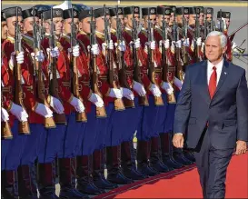  ?? RISTO BOZOVIC / ASSOCIATED PRESS ?? Vice President Mike Pence attends a welcome ceremony Tuesday at Golubovici Airport near Podgorica, Montenegro. Pence, who has visited Estonia and Georgia on his tour, will attend the Adriatic Charter Summit in Montenegro.