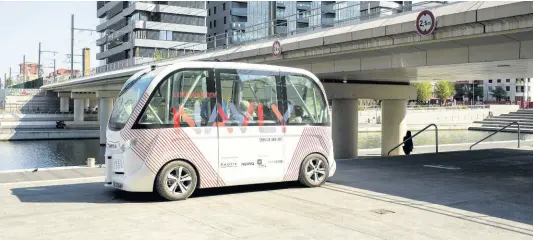  ?? AP/ FILE ?? In this 2016 file photo, the driverless electric free shuttle Navly drives through a district of Lyon, central France, as part of an experiment.