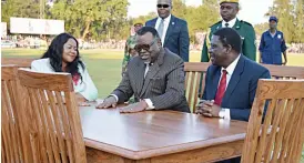  ??  ?? THE Namibian President Cde Hage Geingob (centre) admires the furniture gift they are sitting on, of a table and six chairs, he was given by the Zimbabwe Internatio­nal Trade Fair (ZITF) company after he officially opened this year’s Trade Fair...