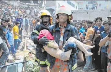  ?? Shariful Islam Zuma Press ?? HUNDREDS WERE also injured in the 2013 Rana Plaza factory collapse in Bangladesh. Factory owners and managers ordered reluctant workers to enter the building despite the appearance of large cracks a day earlier.